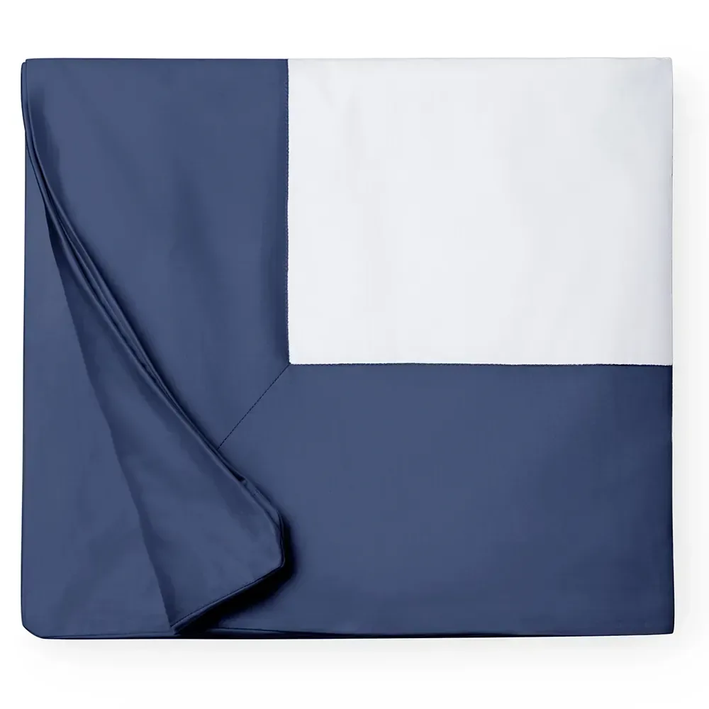 Freshly folded duvet cover and linens for Peninsula vacation rental turnover